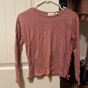 It is a pink Place long sleeve shirt with no signs of wear.